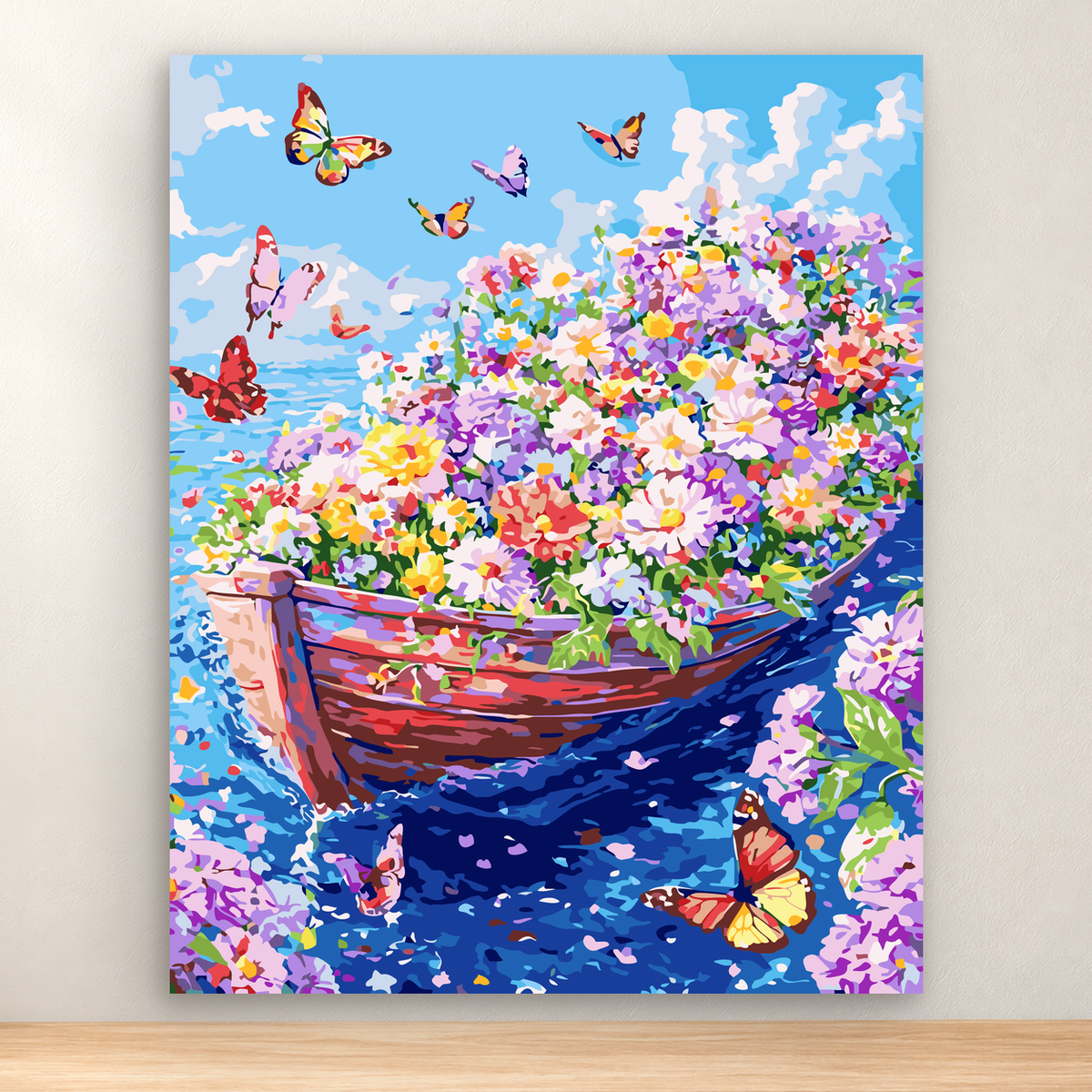 Flower-filled wooden boat with colorful blooms and butterflies on blue water beneath a bright sky, 40x50 cm.